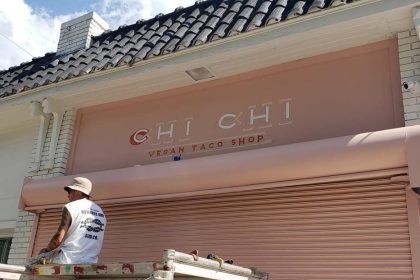 Chi Chi Vegan Taco Shop's pastel pink storefront.