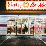 The exterior of a Shipley Do-Nuts 24 hour diner.