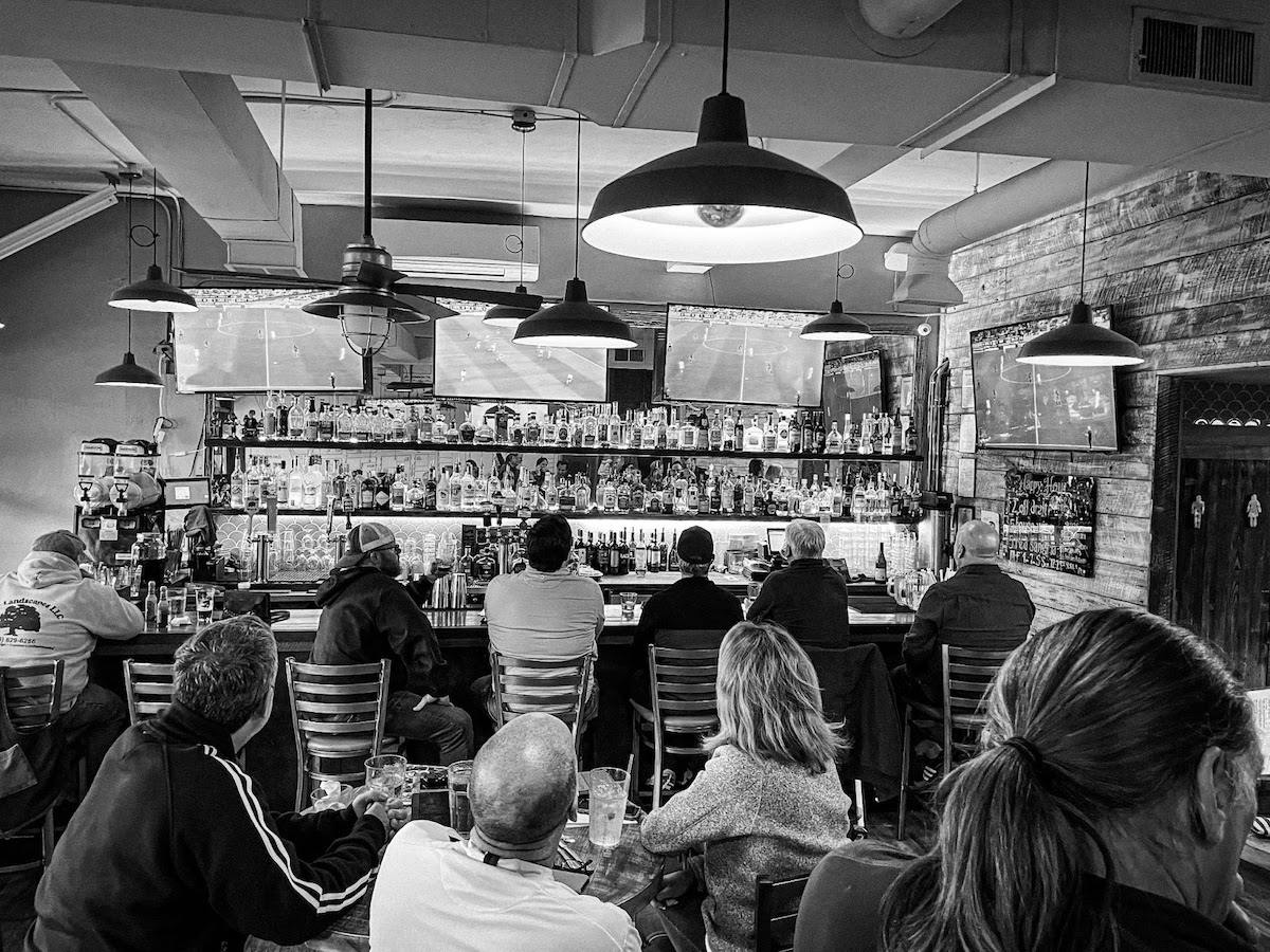 Customers gather as they watch a game at the bar area at Piece Out. Photo courtesy of Piece Out Del Ray.