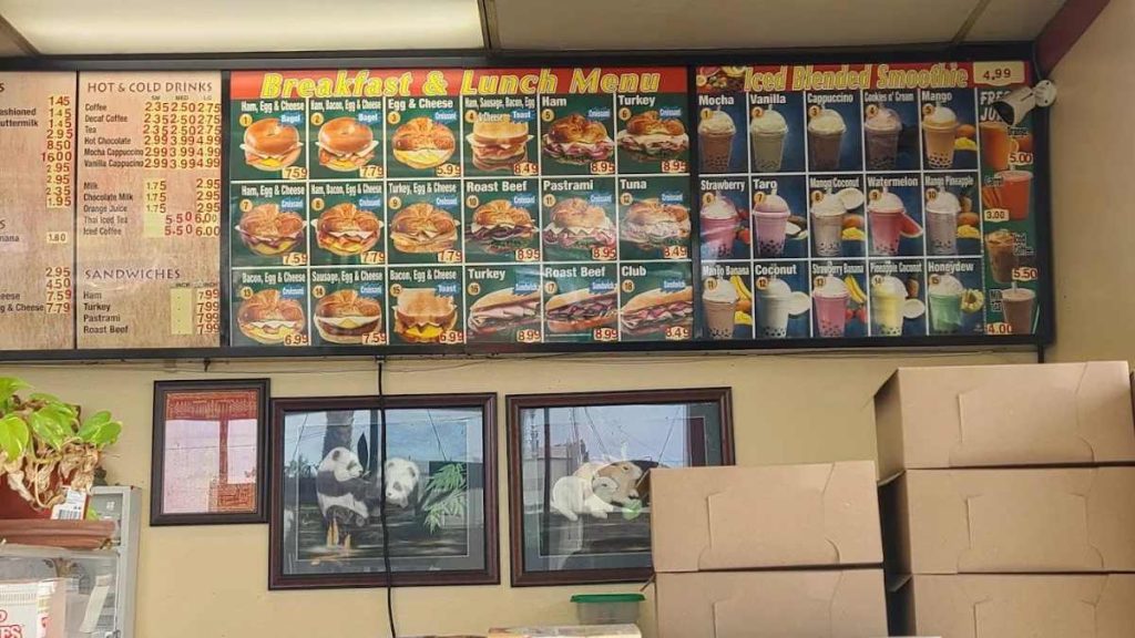 Menu highlights include cinnamon roll donuts, blueberry-banana muffins, all fruit croissant, and pastrami sandwiches.