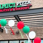 Amici Pizza’s second Queen Creek location opens in July 2025, showcasing its viral signature pies and dining space.