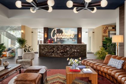 The hotel offers features like 93 guest rooms, an outdoor pool, and a terrace