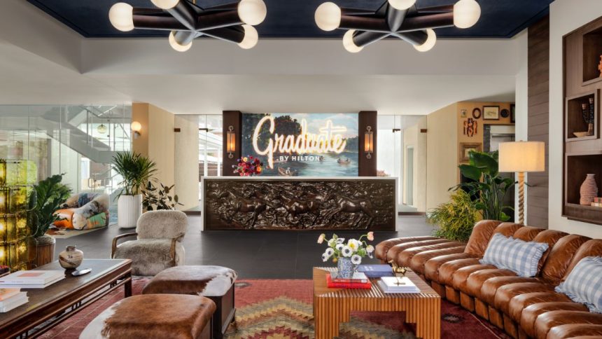 The hotel offers features like 93 guest rooms, an outdoor pool, and a terrace
