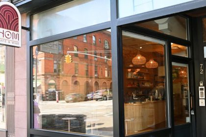 The menu highlights the Asian heritage of the restaurant partners.