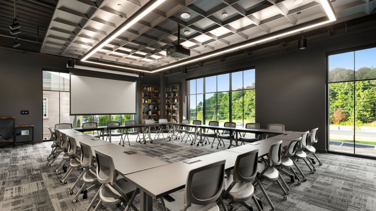 The coworking area features 80 private offices, 13 meeting rooms, and over 35,000 square feet of space.