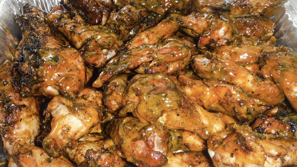 Alkebu-Lan Images Bookstore, SmoQe Signals BBQ Team Up On Hospitality Development