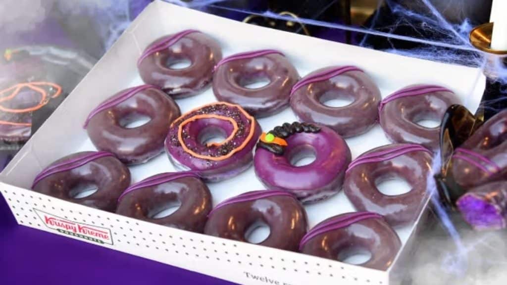 Representation of how a box of beautiful purple doughnuts will look irresistible