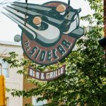 Health inspectors observed no handwashing signage at the warewashing area sink to remind food employees to wash their hands.