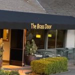 The Brass Door storefront