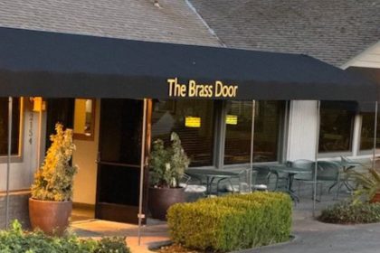 The Brass Door storefront