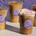 Four coffee drinks with Lilac Coffee branding in front of a purple background