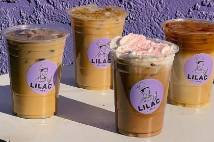 Four coffee drinks with Lilac Coffee branding in front of a purple background