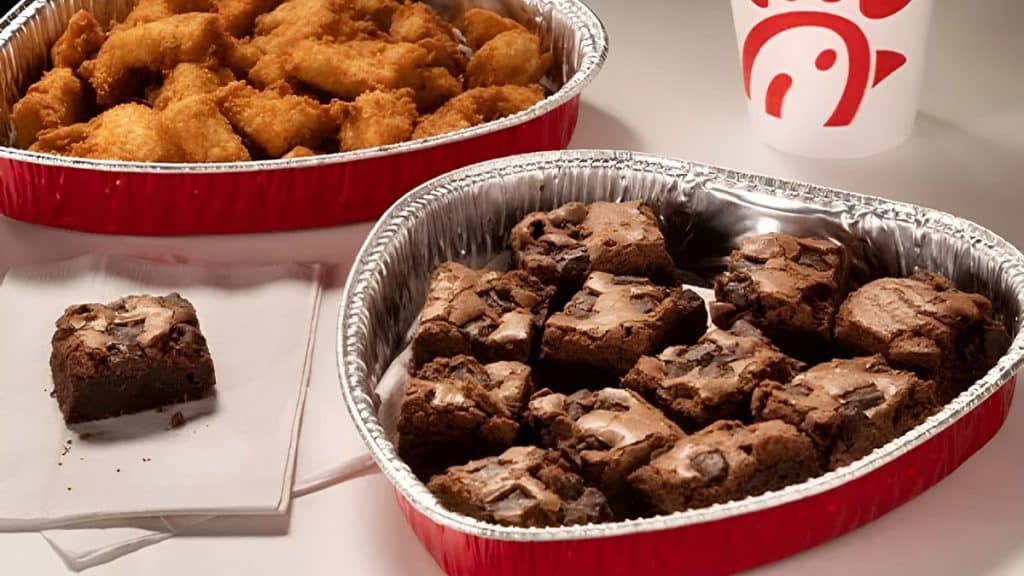 Illustration of Chocolate Brownie Halves and Chicken Nuggets in heart-shaped trays