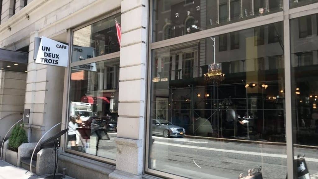 View of Cafe Un Deux Trois from the street (Source: Yelp)