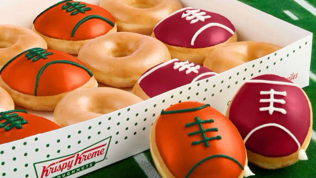 The limited-edition box features football-shaped doughnuts in vibrant team colors along with the company’s classic Original Glazed