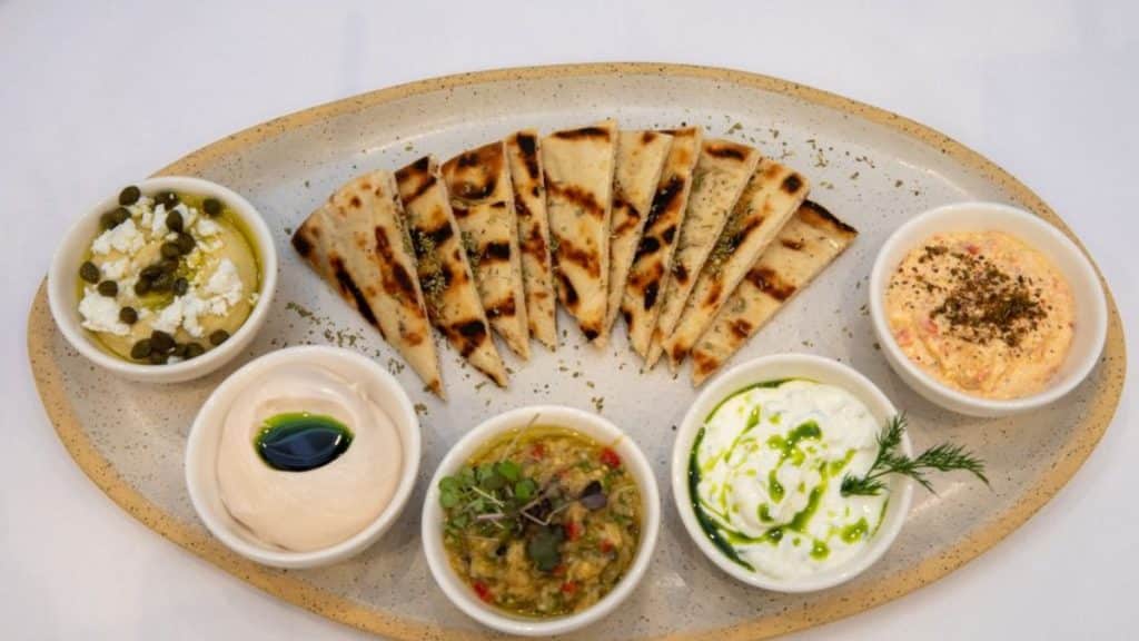 Depiction of a food plate from Delos Greek Restaurant (Source: Yelp by Delos Greek Restaurant)