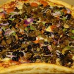 A loaded and large Pizza from Costco