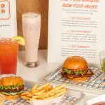 The menu also offers classic sides like crispy fries and garlic fries topped with fresh garlic and aged cheddar.