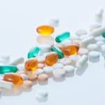 The Woburn-based biotech company cited a regulatory setback tied to its advanced skin cancer therapy as the reason for the layoffs.