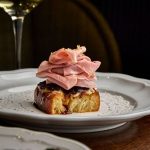 Designed as a neighborhood gathering place, Alla Vita combines Italian classics, locally sourced produce, and flexible event spaces.