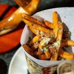 Image of Fresh Cut Truffle Fries served at Uptown Sporting Club (Abante Photography)